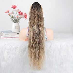 LA00024 lady's hair is styled with a hair clip, a ponytail with water ripples, a fluffy long curly hair